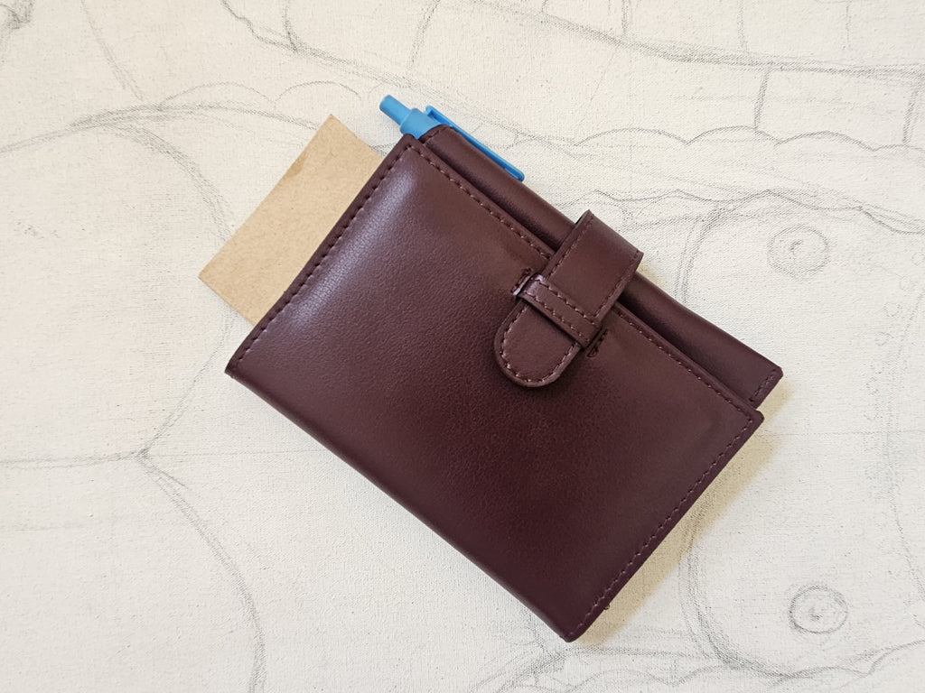 Pasaportera TRVL púrpura